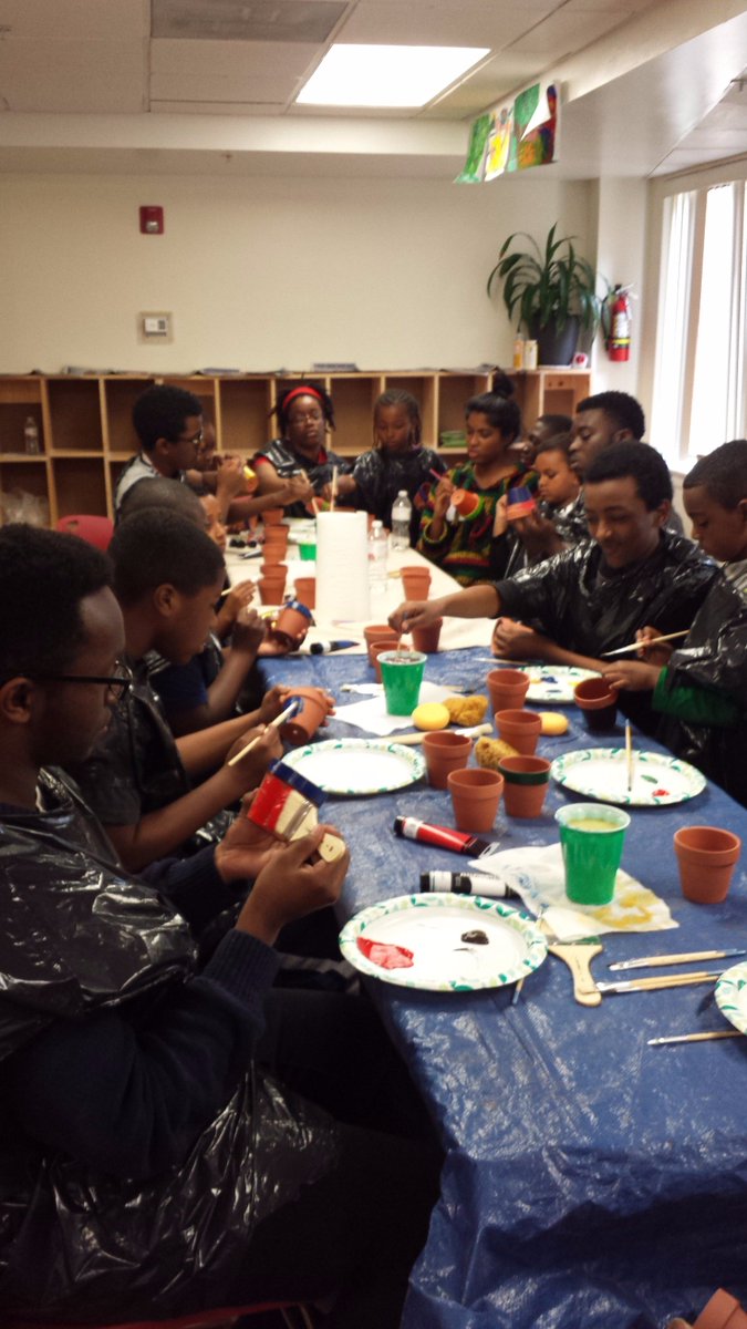 ServiceWorksDC's tweet image. Scholars painted over 40 pots for kids in their community to grow sunflowers in. #EarthDay #GrowAndThrive
