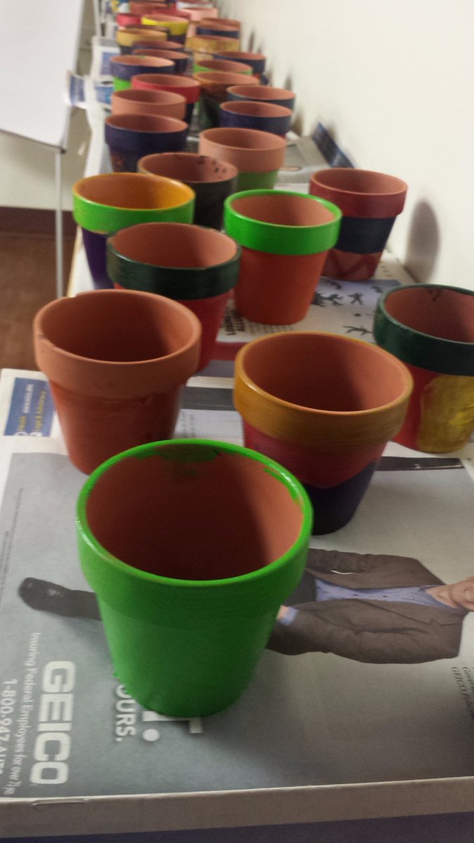 ServiceWorksDC's tweet image. Scholars painted over 40 pots for kids in their community to grow sunflowers in. #EarthDay #GrowAndThrive