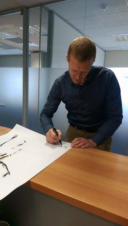 ArticloShop's tweet photo. Henry Shefflin signing an Articló print, to be auctioned off for the Children's Sacred Heart Centre in #Waterford. https://t.co/kag12qkOvD