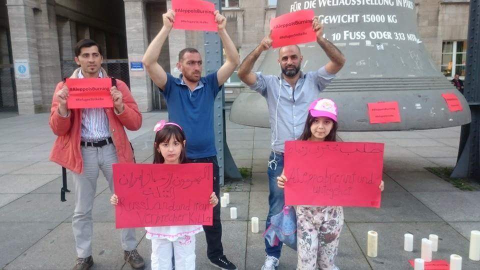 aleppoisburning's tweet photo. #BOCHUM #Germany "We need 2 see our brothers & sisters in SAFETY" #WorldwideREDProtest #AleppoIsBurning #AssadMustGo https://t.co/h5iv2AoruR