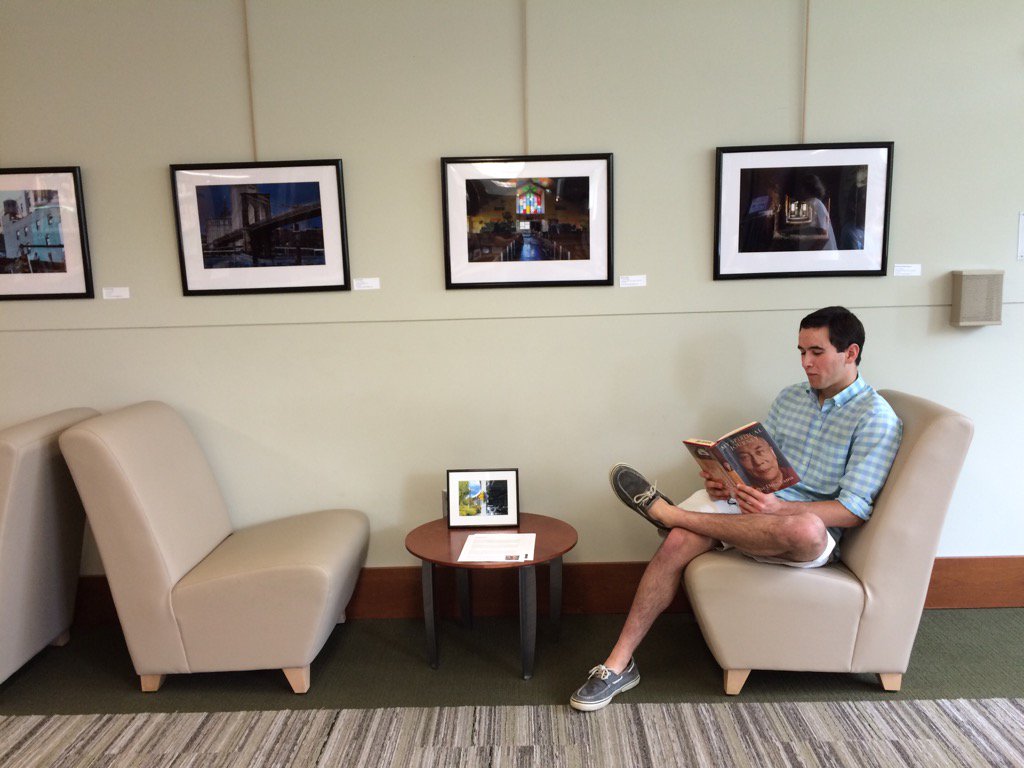 YorktownPhoto's tweet photo. Joe Diconsiglio takes a reading break at the opening of his solo phto show at the Westover Library @ArlingtonVALib https://t.co/gT7Mydodxg