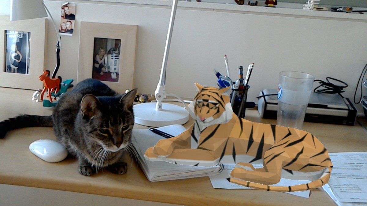 crackerfactor's tweet image. Two cats on my desk this morning... #HoloLens #virtualCat
