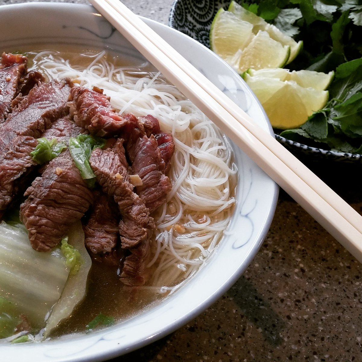 waiyeehong's tweet photo. #hotpotsupper leftovers part 3. Rice vermicelli soup with lots of fresh herbs and plenty fish sauce. https://t.co/1SNglb1UEL