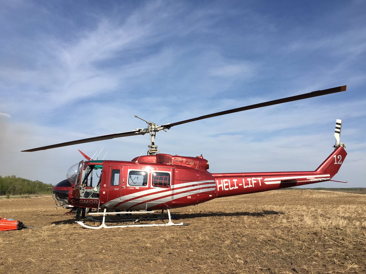 swfisherfarms's tweet photo. Wow! How often do u get to see a Huey 205 up and close?? Fighting a fire 2 miles from home. #saskfires https://t.co/CShOIgI4Cw