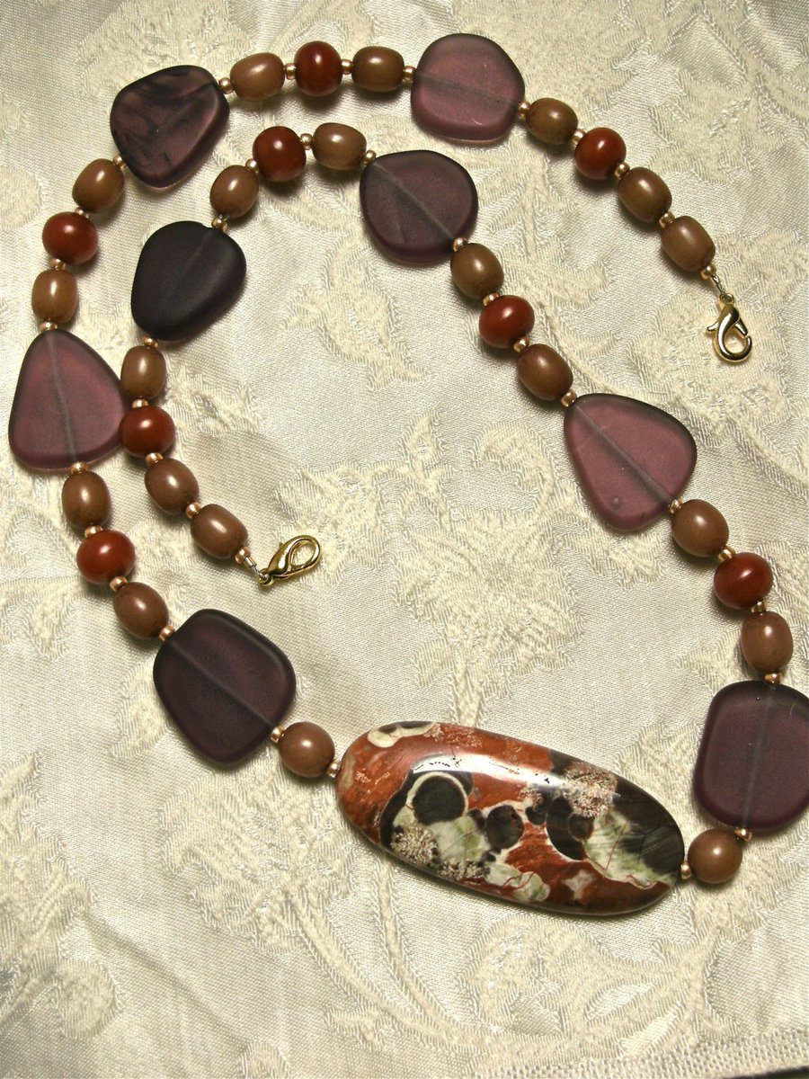 lfein1's tweet photo. Rhyolite Amber Beach Glass Necklace https://t.co/8uoQLDmC1S #handmadejewelry #EarthyNecklace https://t.co/R6S18EJJko