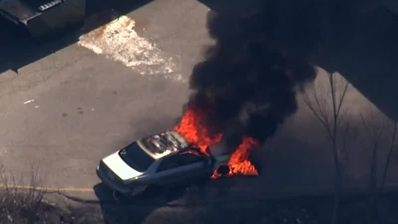 Suspect from chase in custody, his car still burning near to where he was caught. wcvb.tv/6011BmV4c