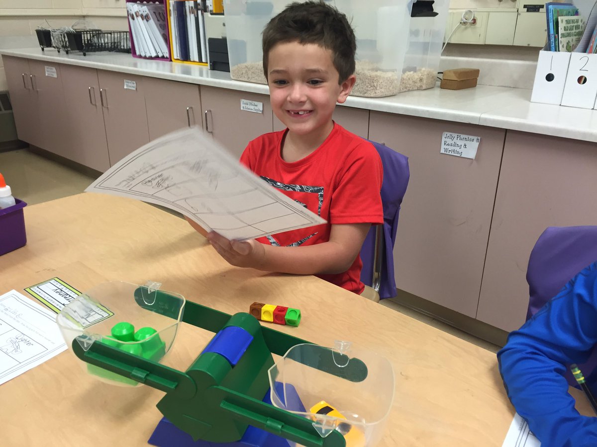 Using a balance to see which classroom objects weigh more or less. #le58rocks #dg58learns