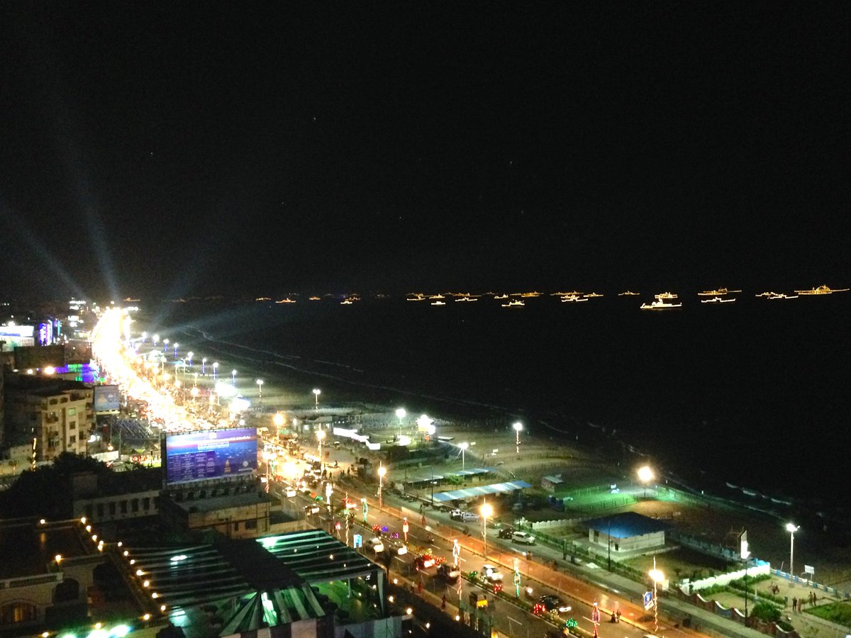 hanyimusic's tweet photo. Warships gather from around the world lit up by fairy lights off the coast of #Visakhapatnam, India. #ifr2016 https://t.co/5kCI2ab7ov