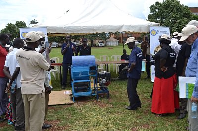 Farmers sharing experience and Busitema University demonstrates a fabricated rice threshing machine #Mechanization
