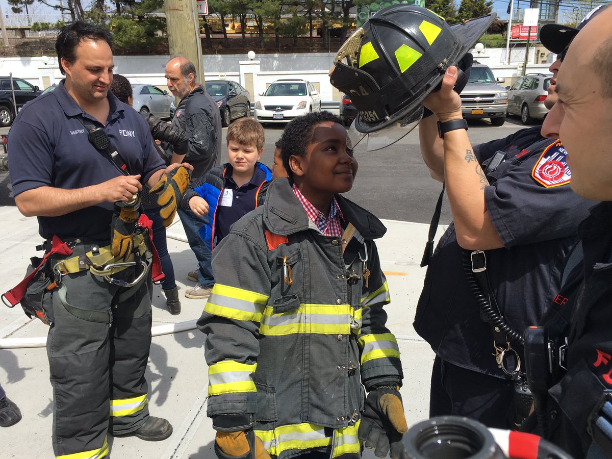 FDNY's tweet photo. Children affected by events of 9/11 were welcomed to #Engine304 & #Ladder162 w/ @Tuesdayschldrn #NeverForget https://t.co/9fAgEgjSXo