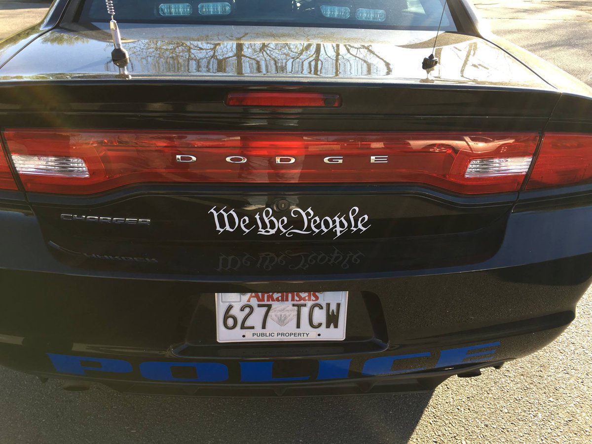 ThinkAtheist's tweet photo. Defying “In god We Trust” Trend, Arkansas Police Dept Puts “We the People” On All Vehicles https://t.co/NtVvRdYjC7 https://t.co/DS5lAcwKWl
