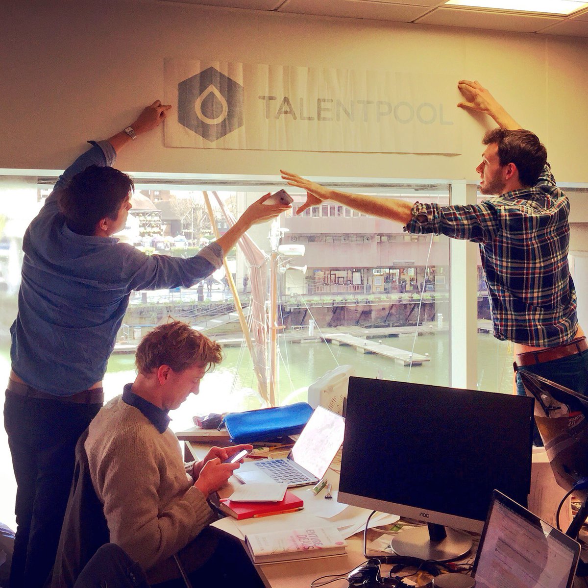 RainmakingLoft's tweet photo. TalentPool installing their new logo over their desks 🎉👌🏼#HeroesAtWork  #startup #coworking #LoftCommunity https://t.co/CDlmr7QAtW