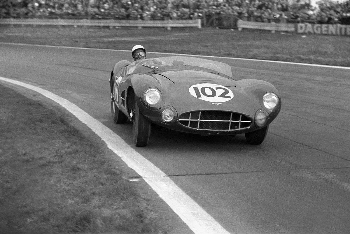 CandSCmagazine's tweet photo. Sir Stirling Moss at the wheel of an Aston Martin DBR2 at Goodwood, 1958. https://t.co/a4Mm3ZT97x