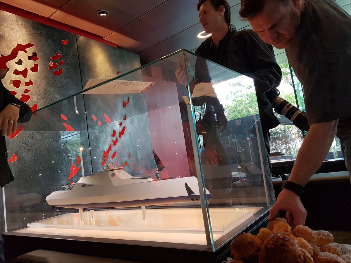 DanWillsTiser's tweet photo. Tiser tog @caljamma with two miracles of French innovation. Pain au chocolat and a DCNS warship. @theTiser https://t.co/bgCsqvwOKP