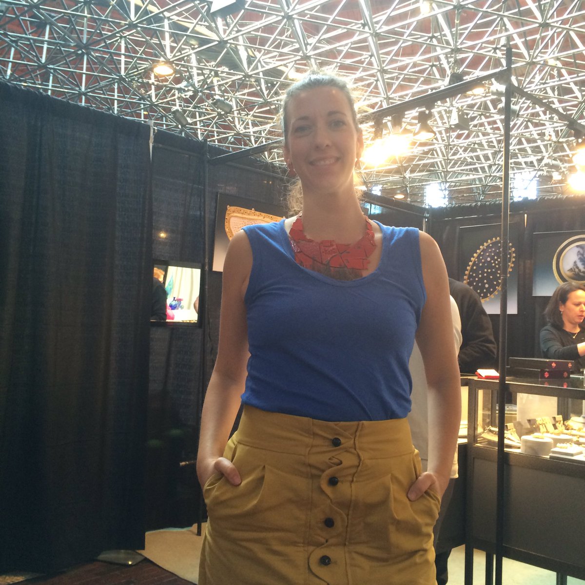 Societyofcrafts's tweet photo. Kat Cole models one of her architectural necklaces in the amazing historic cyclorama—here at #CraftBostonSpring https://t.co/nk9NlY5s46