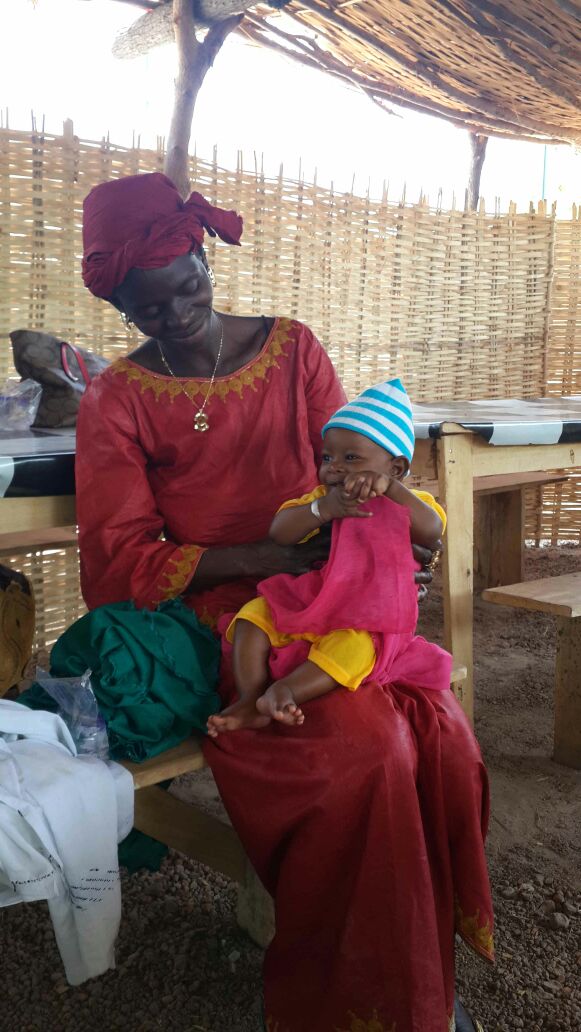nourbenomar's tweet photo. Papa's mama #cutestbaby #Senegal @dabaddo bringing connectivity education &amp; energy at a price all can afford https://t.co/h9becloBnG