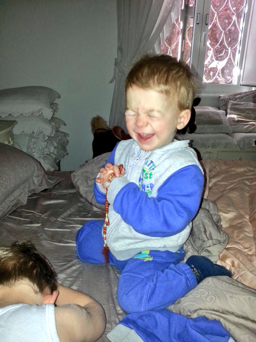 FlorianKolfhaus's tweet photo. My God son's first rosary. Looks like he is having fun. https://t.co/hsMv981MnD