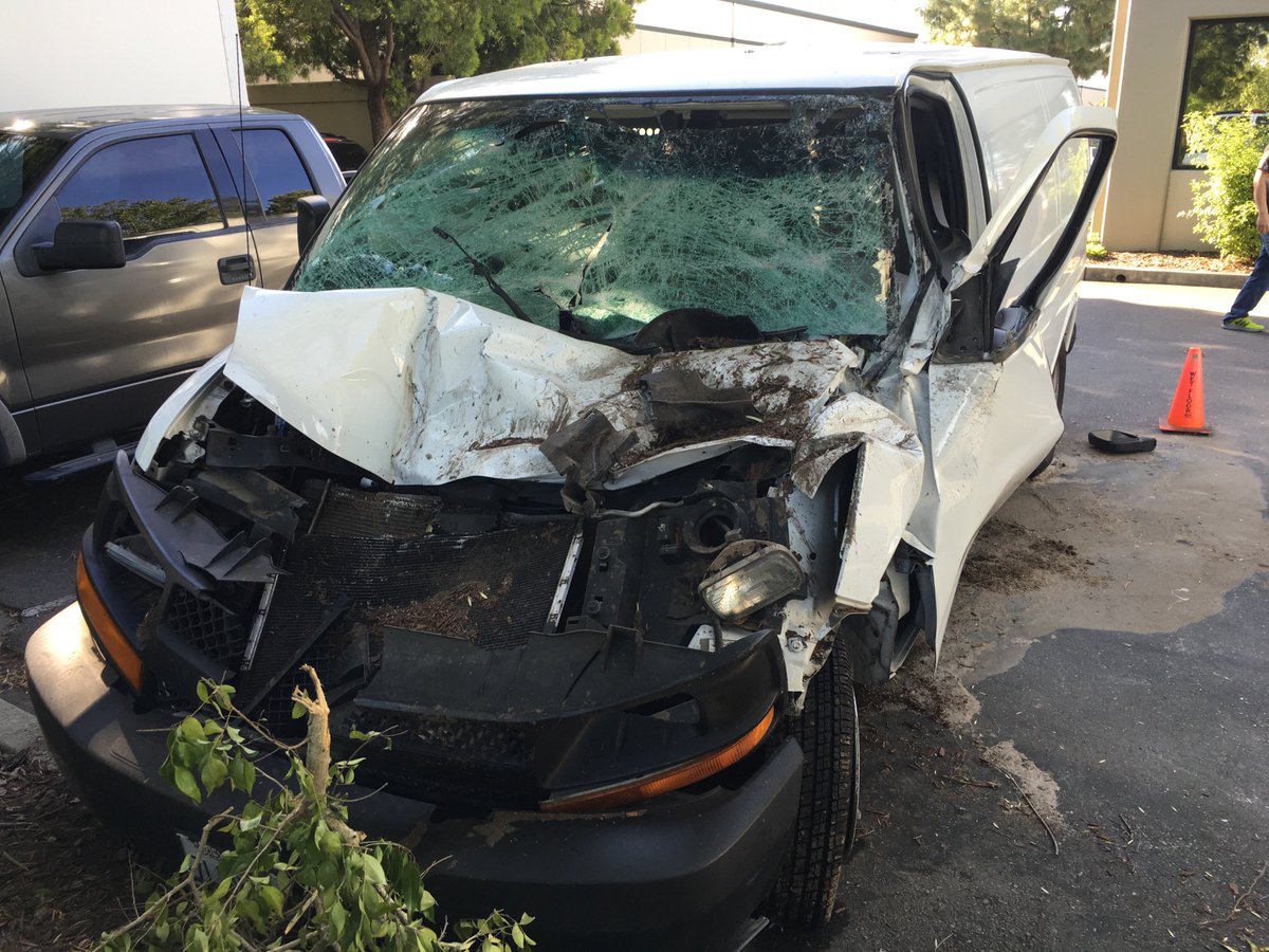 Flip2Media's tweet photo. A Dodge Charger landed on top of our parked production van over the weekend.  How's your Monday? #rainingcars #ouch https://t.co/qAL3jmkVEB