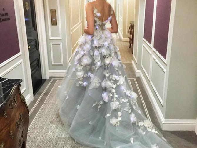 CNET's tweet photo. Karolina Kurkova wears Met Gala dress designed by IBM Watson https://t.co/l5O70f36W9 https://t.co/916HCAVeqm
