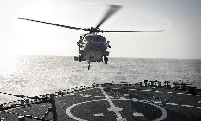 USNavyEurope's tweet photo. Taking off &amp; landing a Seahawk on a moving, shifting landing pad; another day at the office for #USSPorter &amp; #HSC28 https://t.co/HlL37m7LMg