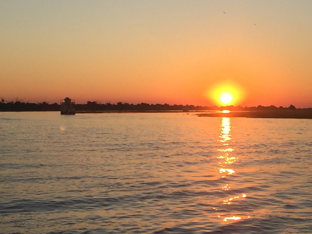 kentredding's tweet photo. Sunset, Chobe River #Botswana. #Chobe Game Lodge has some solar powered boats, electric game vehicle &amp; female guides https://t.co/Bdc0kuit2N