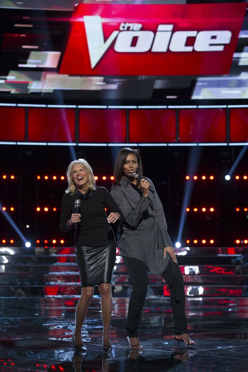 First Lady Michelle Obama and Dr. Jill Biden share a laugh during rehearsal prior to the kick off of the 5th anniversary of their Joining Forces initiative on NBC's The Voice at The Voice studio in Burbank, Calif., May 2, 2016. (Official White House Photo by Amanda Lucidon)