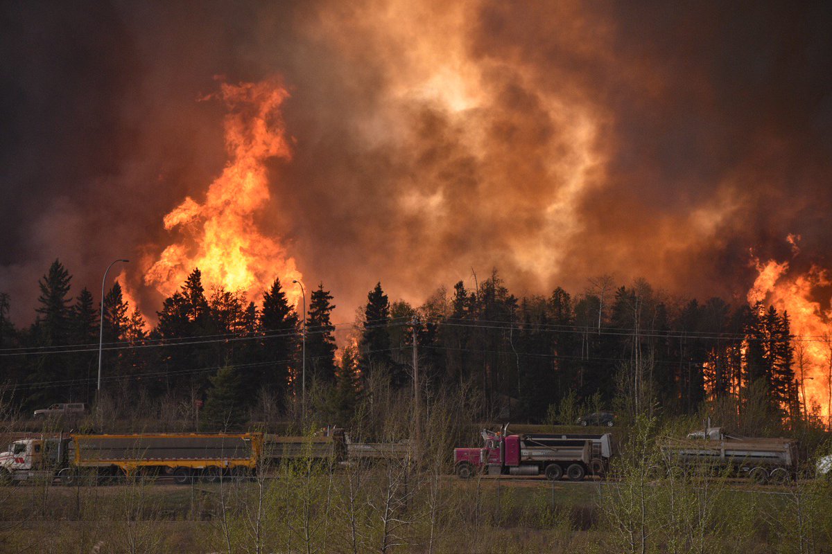 CBCCalgary's tweet photo. #CBC reporters confirm homes are now burning in Fort McMurray in Beacon Hill and in the Centenial Trailer Park. #ymm https://t.co/jfR3icD41r