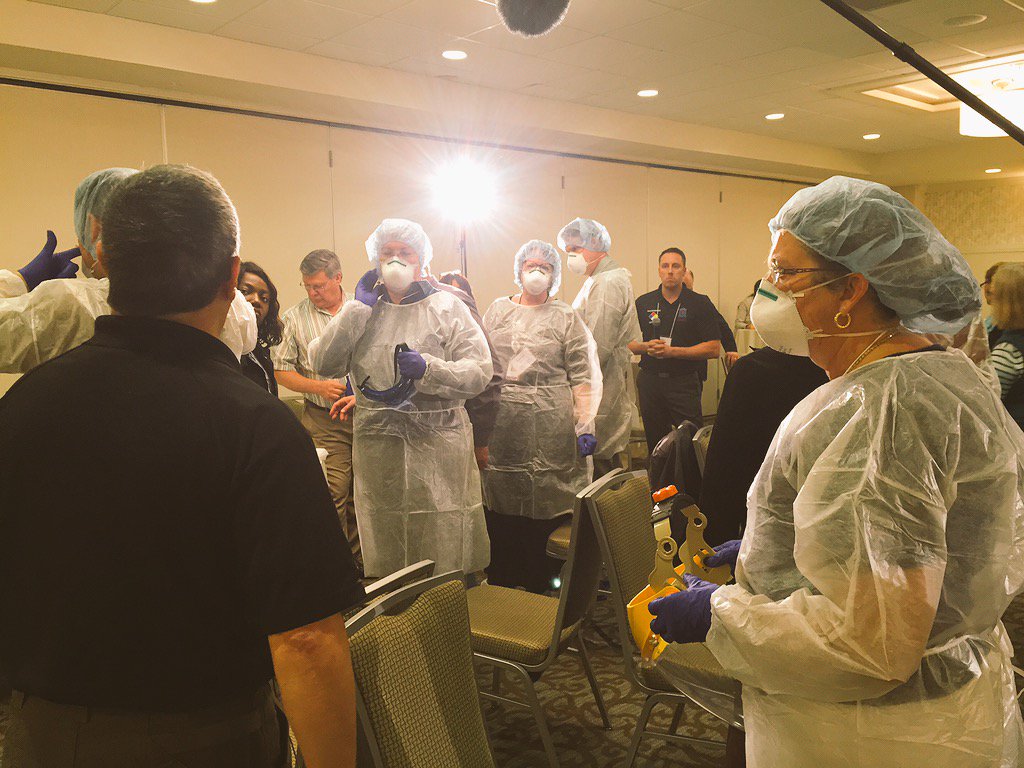 MassLeague's tweet photo. #CHCs practice donning and doffing #PPE at the pre-CHI session on Emerging Infectious Disease https://t.co/tOt31ndxr6