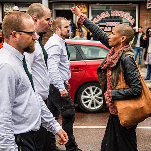 sukisangh's tweet photo. Incredibly powerful moment captured on camera. Activist Tess Asplund confronts 300 fascists in Stockholm. Respect https://t.co/ADeRzjCyZl