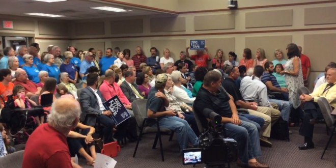 Hatewatch's tweet image. Haters sing 'Jesus Loves Me' to drown out lone #trans rights speaker at SC school #LGBT joemygod.com/2016/05/02/sou…