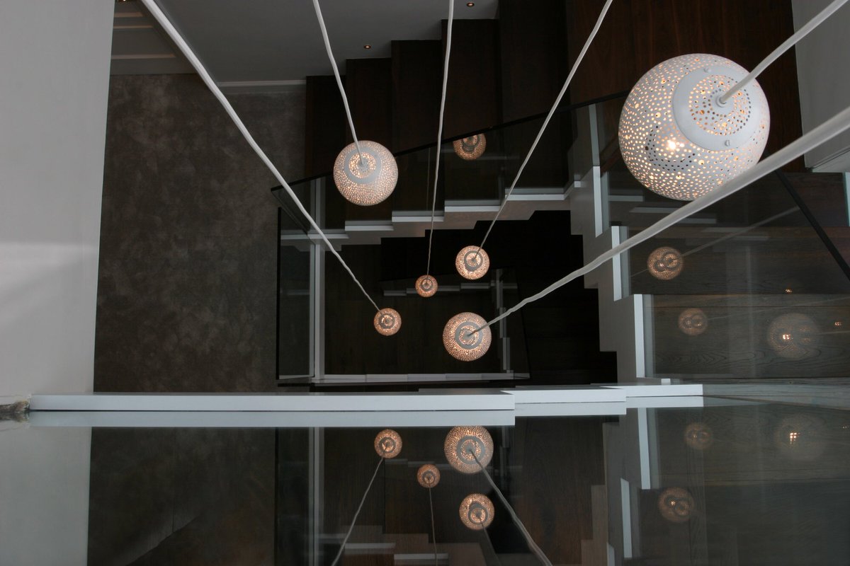 designedbylight's tweet photo. A cluster of our Rita 150 #pendant lights hanging down a stairwell #interiordesign #lighting #lightingdesign https://t.co/pHWoqKYhh0