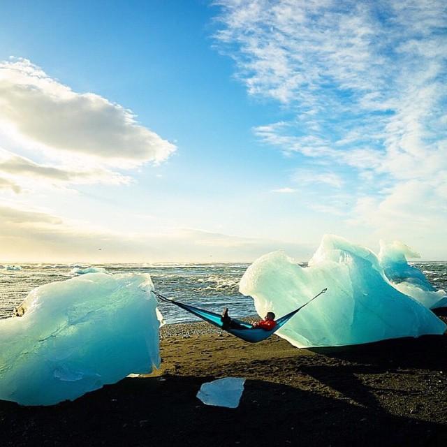 tentmentality's tweet photo. Nothing like relaxing between two gigantic pieces of ice. Photo by @chrisburkard. Tent Life! #hiking #camping #trout https://t.co/HuK1QE7Sub