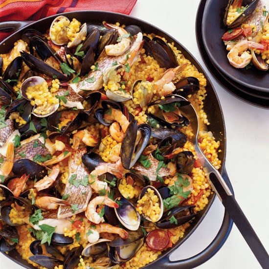 foodandwine's tweet photo. These paellas combines all of our favorite ingredients. https://t.co/fGT48oqa8r https://t.co/w7g4qc4qwa