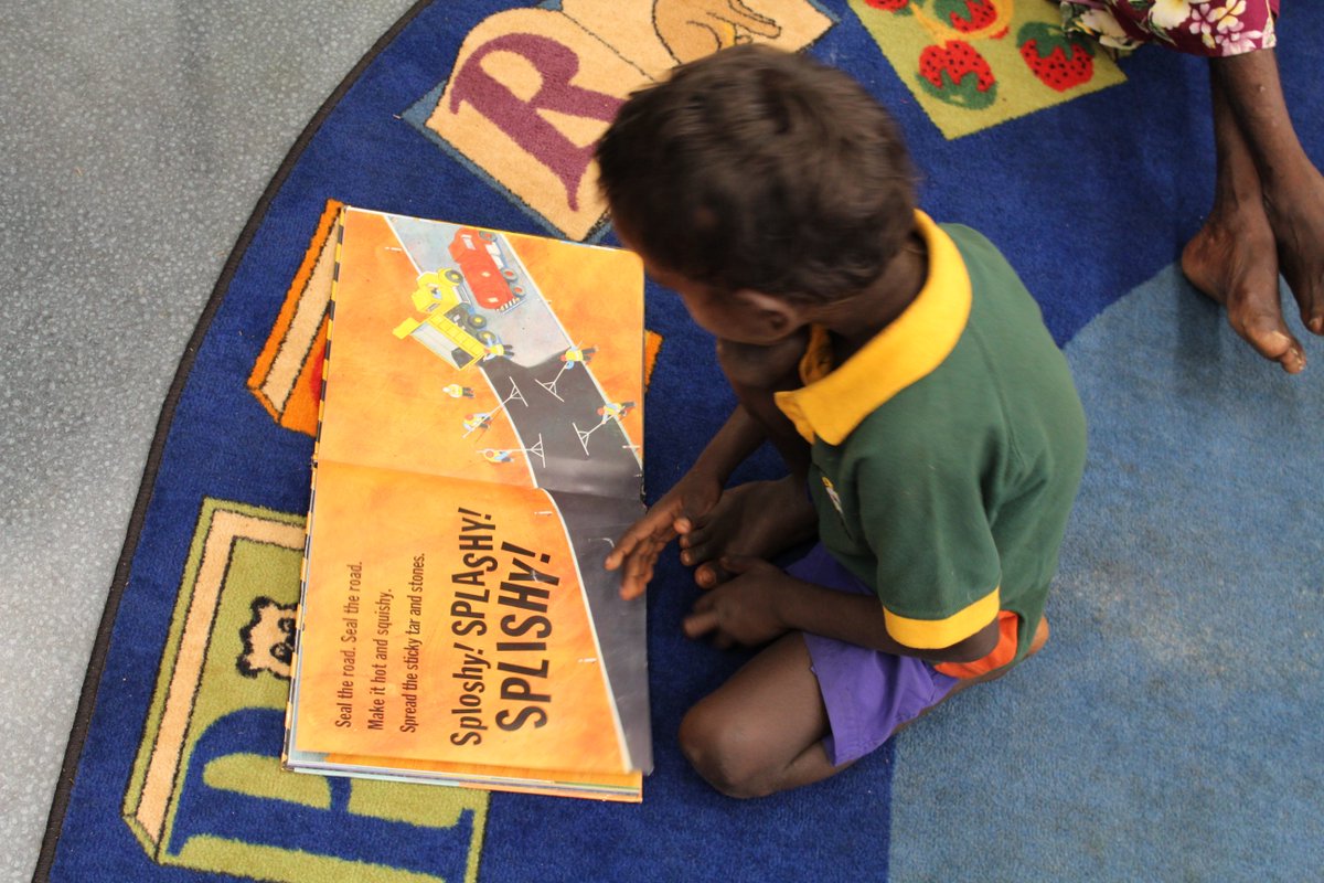 OLSHTCC's tweet image. @OLSHTCC primary students enjoy reading books in the library. #Wadeye #NT #education #Australia