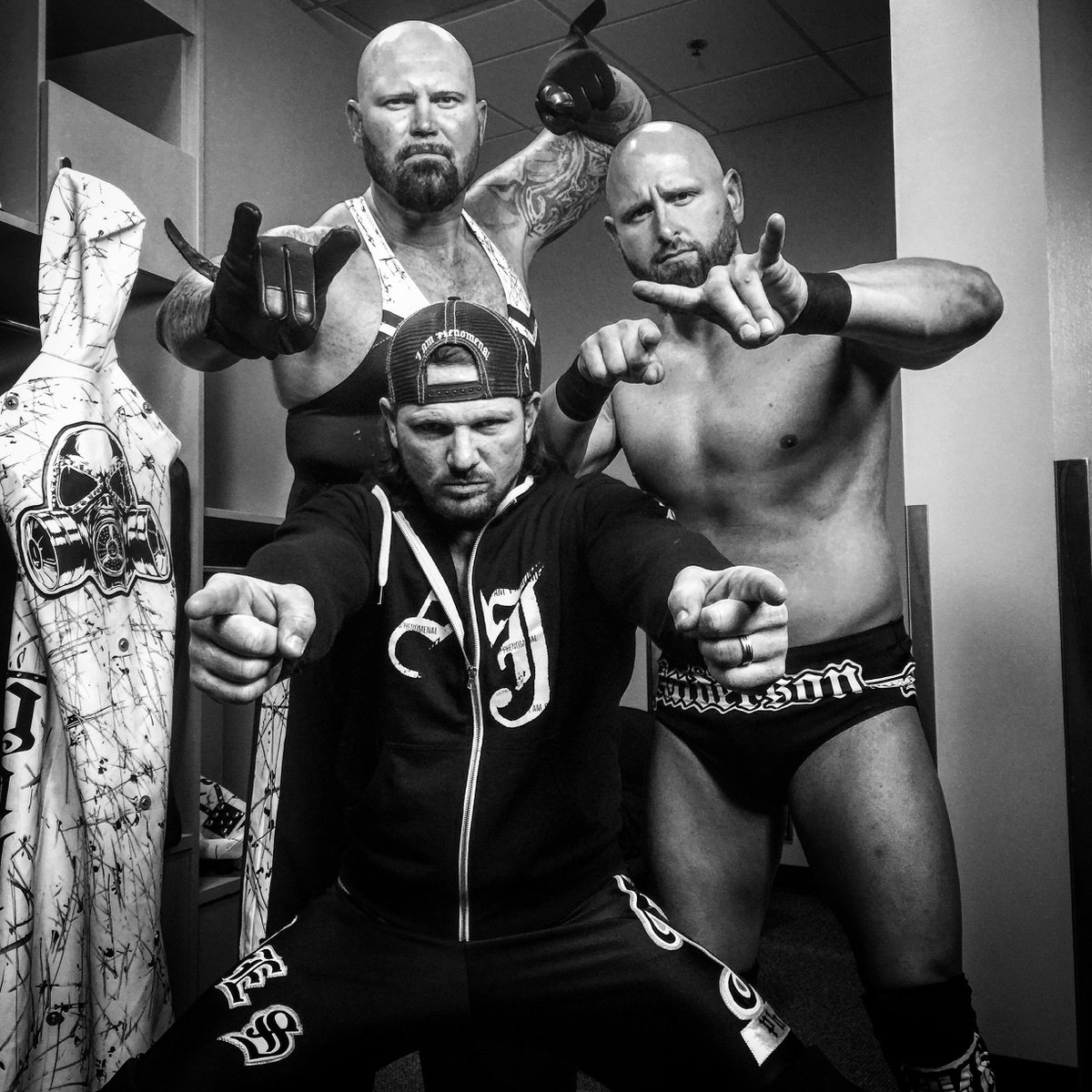 WWE's tweet photo. #WWE's @Machinegunka, @ImpactDOC and @AJStylesOrg are on the same page with victory on the mind. #SmackDown https://t.co/U81uHENNf0