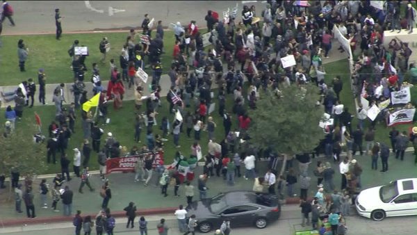thehill's tweet photo. WATCH: Protesters greet Clinton in Los Angeles https://t.co/lx5dWIyE43 https://t.co/2bh3It2V2M