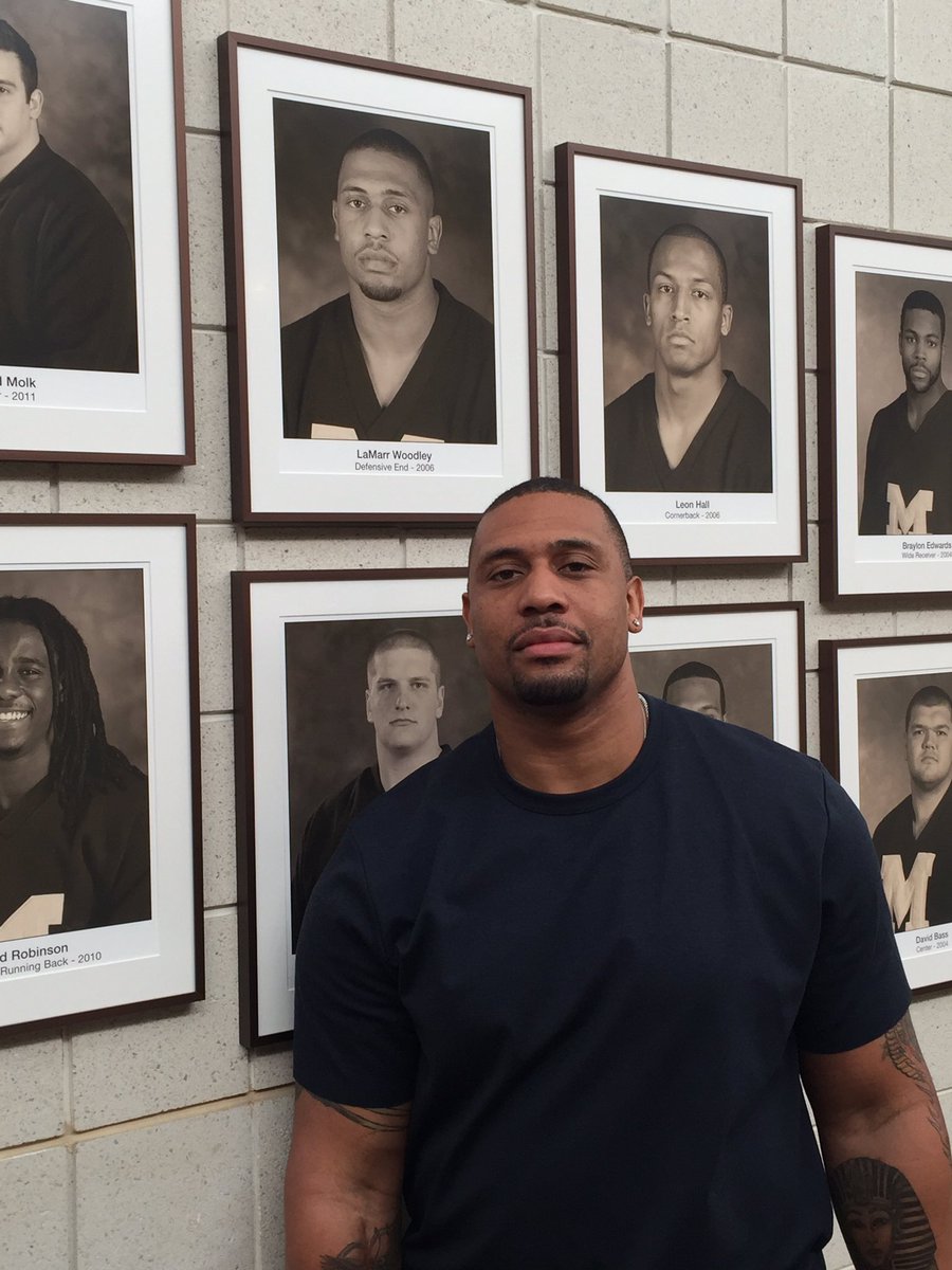UMichFootball's tweet photo. Great having @LaMarrWoodley back in town! Hasn't aged a day. #GoBlue https://t.co/ADw4TlymFW