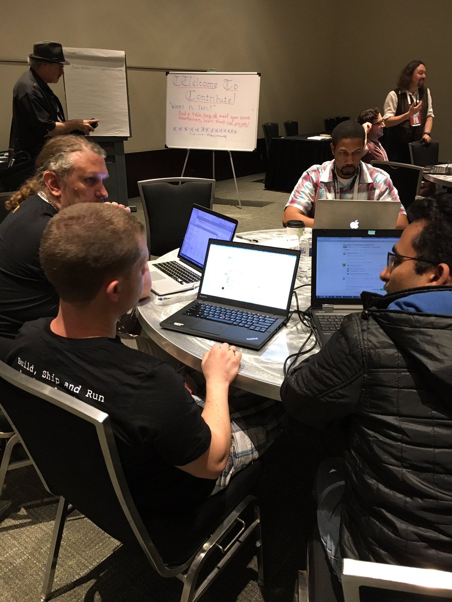 Docker's tweet photo. #OSCON Contribute session is happening now w @docker in Mtg Rm 6! Hack away w @vieux @LK4D4math @avsm @normalfaults https://t.co/l7cyQgYngW
