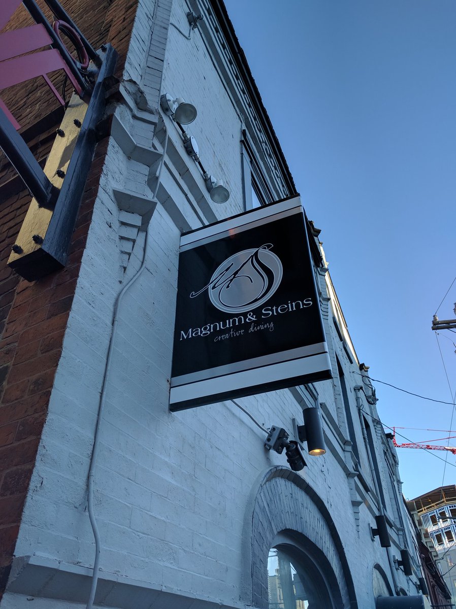 Entrance sign of Magnum and Steins at The Duckworth in St. John's, Newfoundland and Labrador