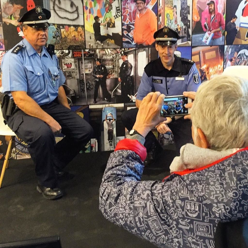 StArtEverywhere's tweet photo. Martha photographing the Berlin police in front of her famous NY cops piece #marthacooper #urbannation #snapwrap #eโฆ https://t.co/MLus2853Iw