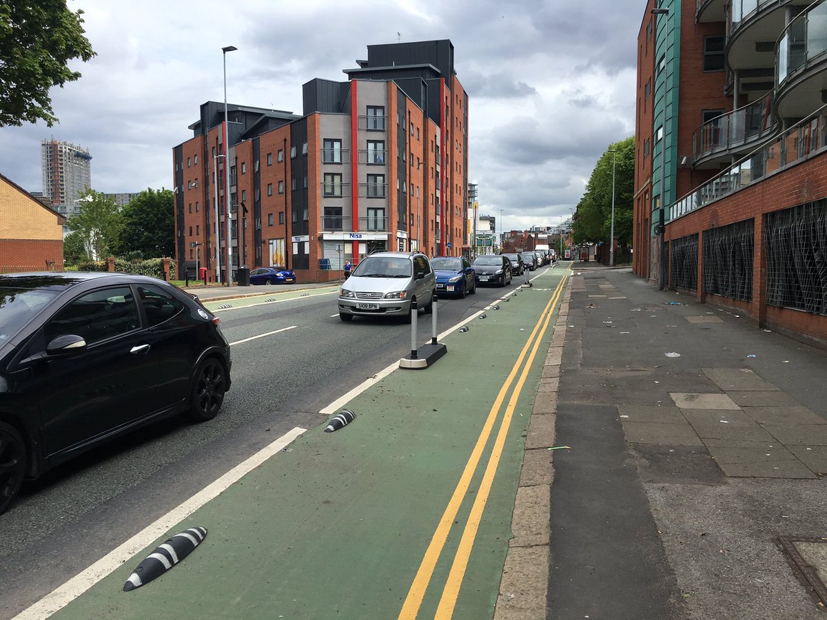JonathSchofield's tweet photo. The way Salford cycle lanes are overused is impressive. Good job other road users aren't inconvenienced by queues https://t.co/E3vO3t4U8l