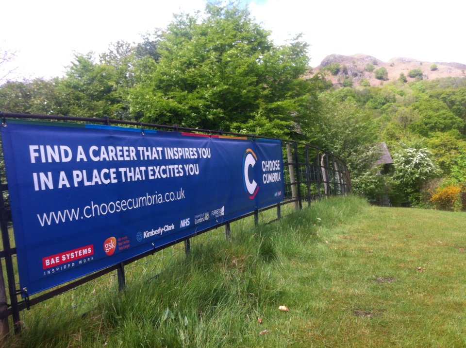 We're just putting up banners from our great sponsors <a href="/ChooseCumbria/">Choose Cumbria</a> with Loughrigg Fell in the background