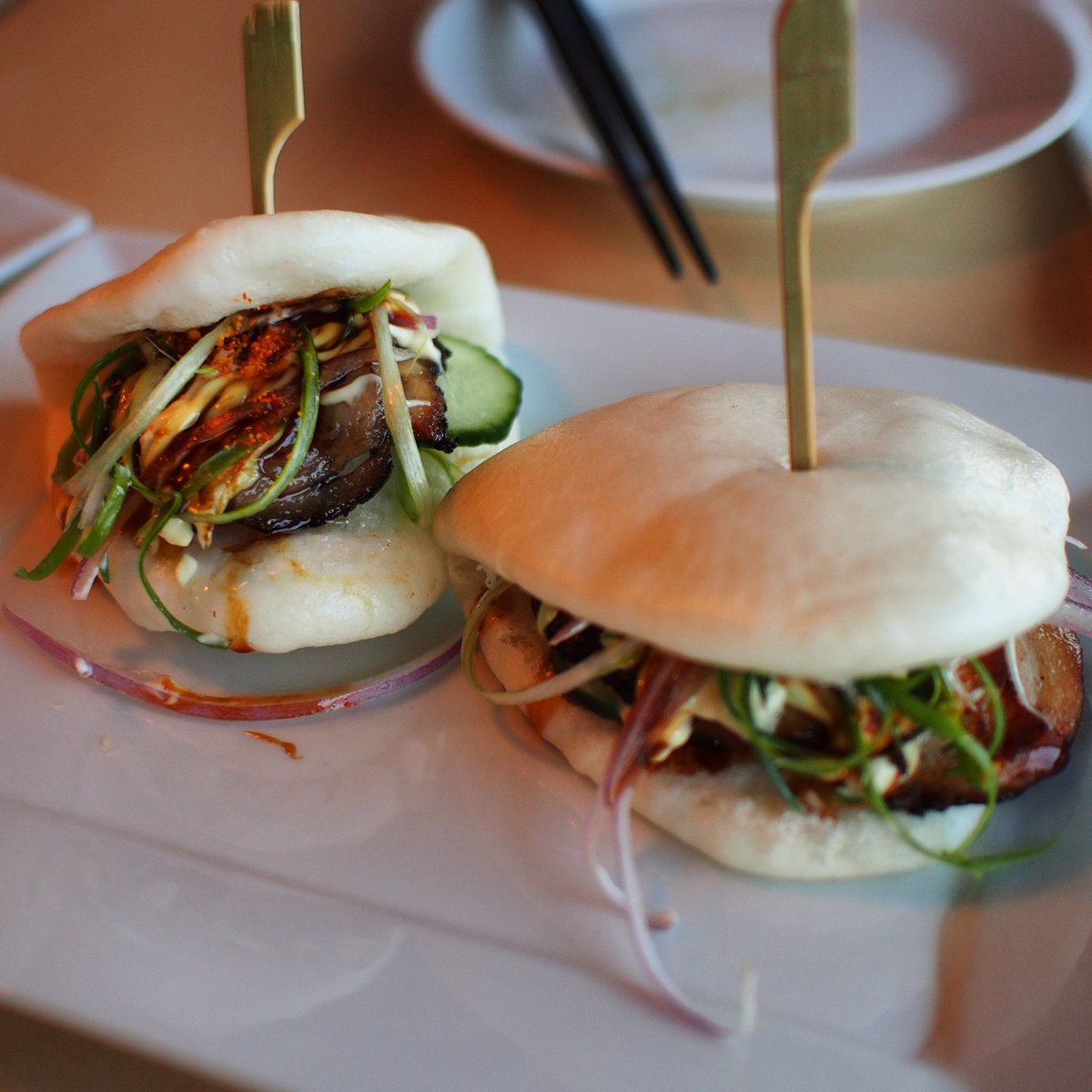 WeTasteFood's tweet photo. I could defs go for some savoury, delicious Chashu Buns @UmamiNoodle_Bar on a cloudy day like today. #YYCeats https://t.co/Nf3785sgeO