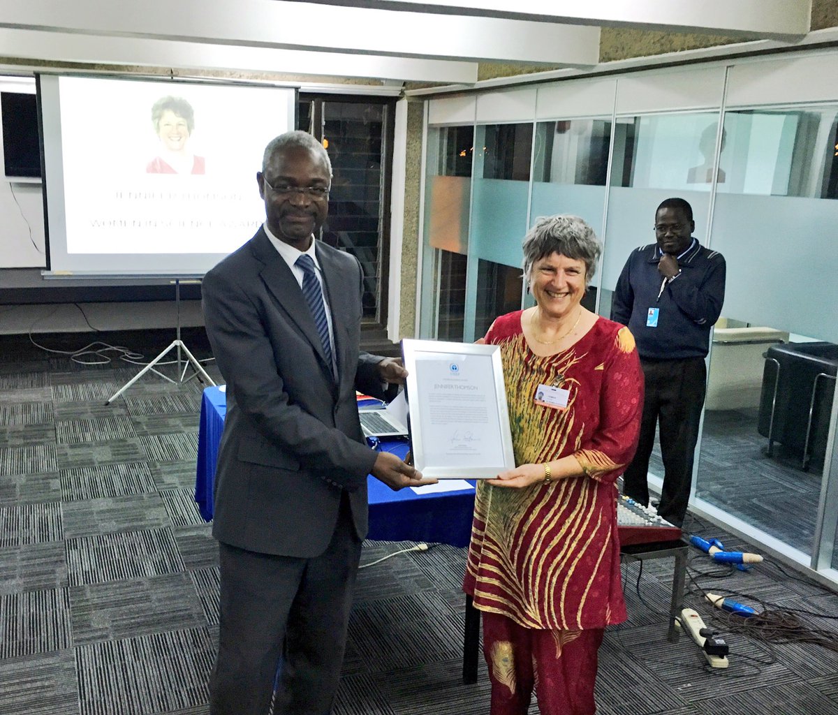 UNEP's tweet photo. .@ibrahimthiaw presents the Women in Science Award to Professor Jennifer Thomson at #SCIPO16 #UNEA2 https://t.co/89bW8yPmB7