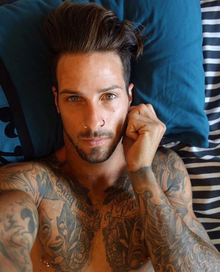 Man With Tattoos And Facial Piercings HighRes Stock Photo  Getty Images