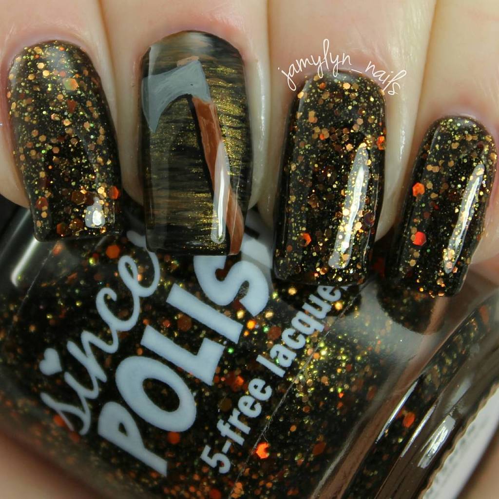 jamylyn_nails: This is 'The Huntsman' by <a href="/sincerelypolish/">Karen Jo</a>. A black jelly with a mix of gold, bronze and caramel gli…