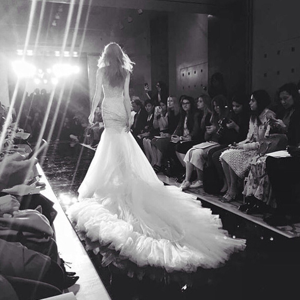 Reem_Acra's tweet photo. One of our favorite moments from the #Spring2017 bridal show. 
#ReemAcraBride #TrainForDays #ShowStopper @namani_mua https://t.co/wPLJPV8ela