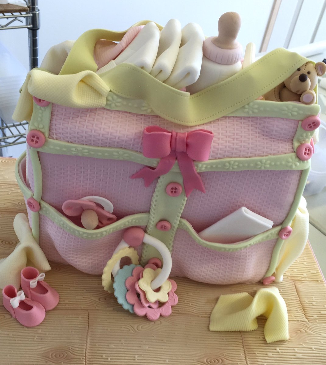 cakesandsugar's tweet photo. Baby bag cake 😊 https://t.co/cNM3Rw7re0