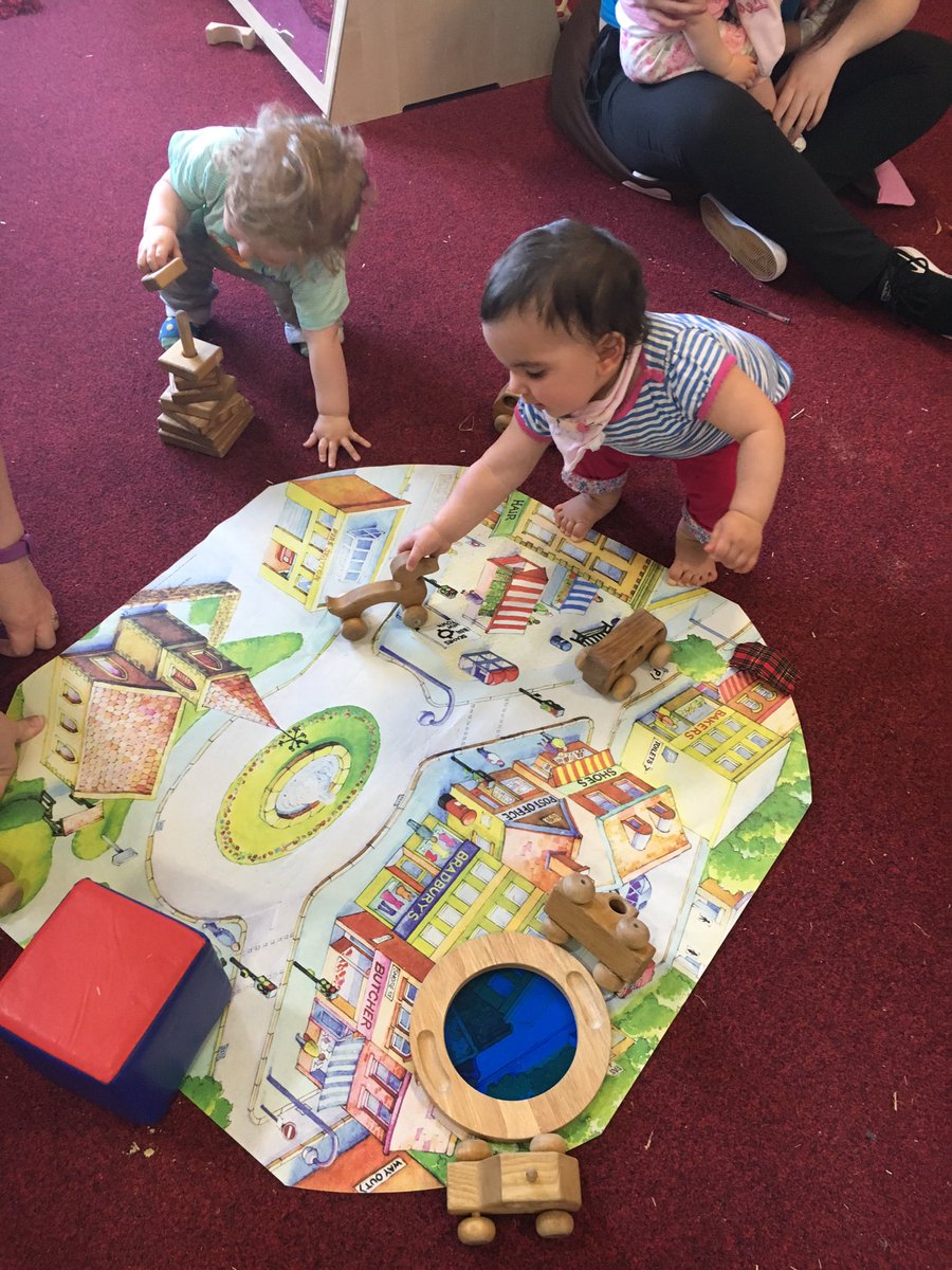 EFInverkip's tweet image. Sun dancers Lawrie and Francesca using the wooden wheeled animals and cars #pushalong #finemotor