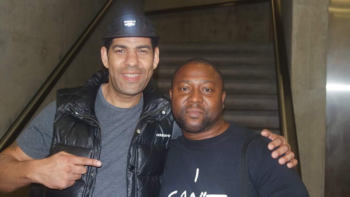 BlackLivesUK's tweet image. Lyndon Gibson @EmbCmm (pictured right), one of the organisers, with audience member Simon Morely #Injustice